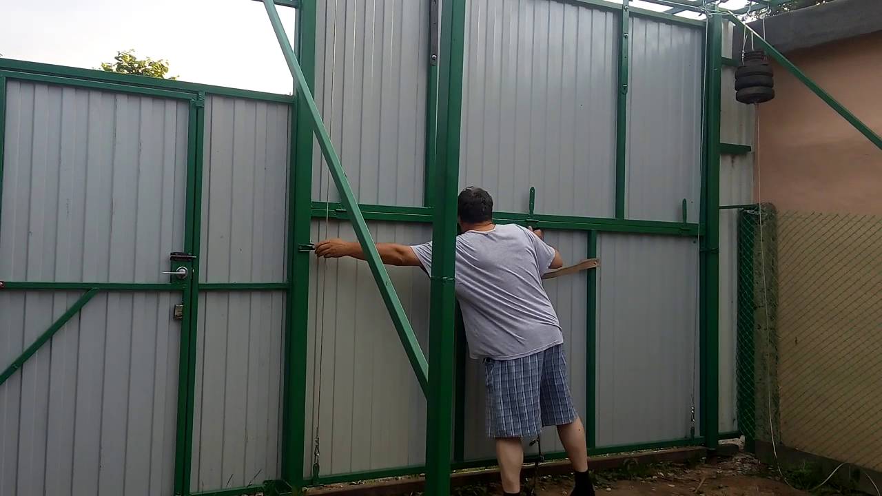Как сделать подъемные складные ворота для гаража своими руками